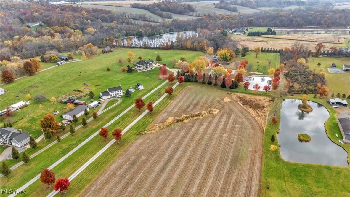 Aerial overview of property's location featuring a large body of water and rural landscape