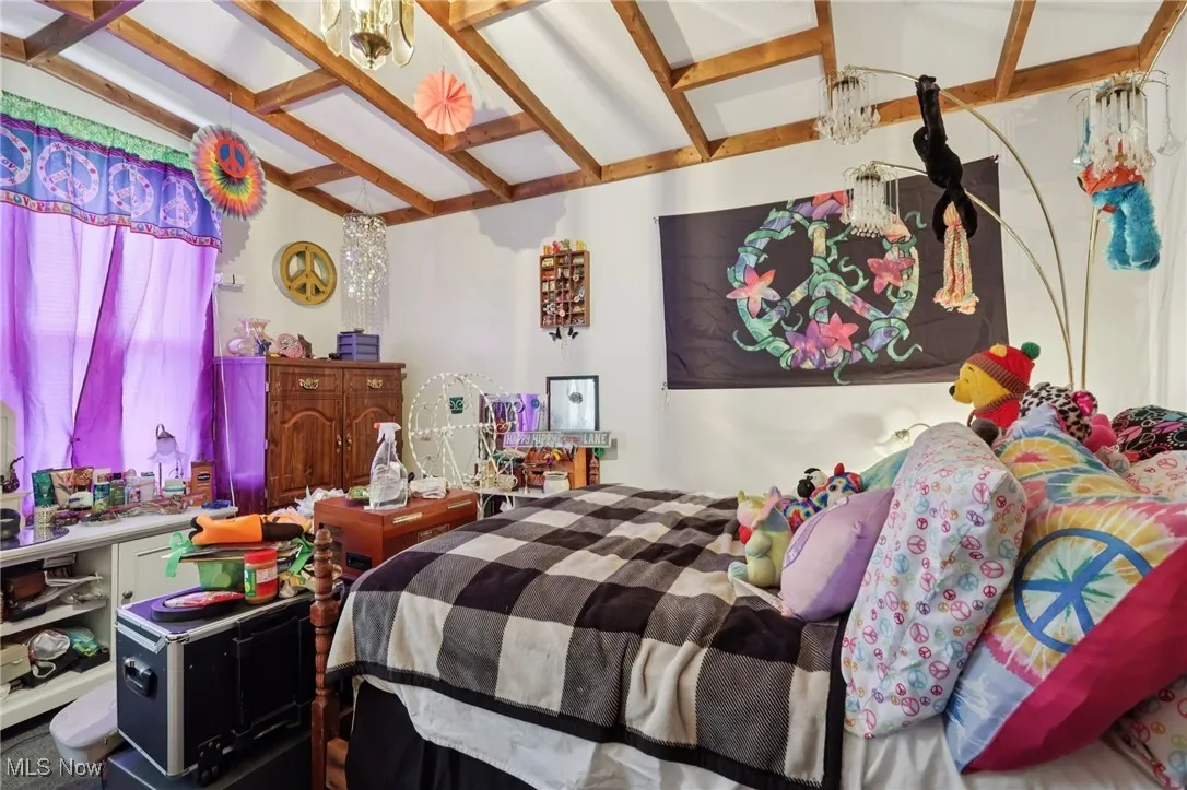 Bedroom featuring beam ceiling