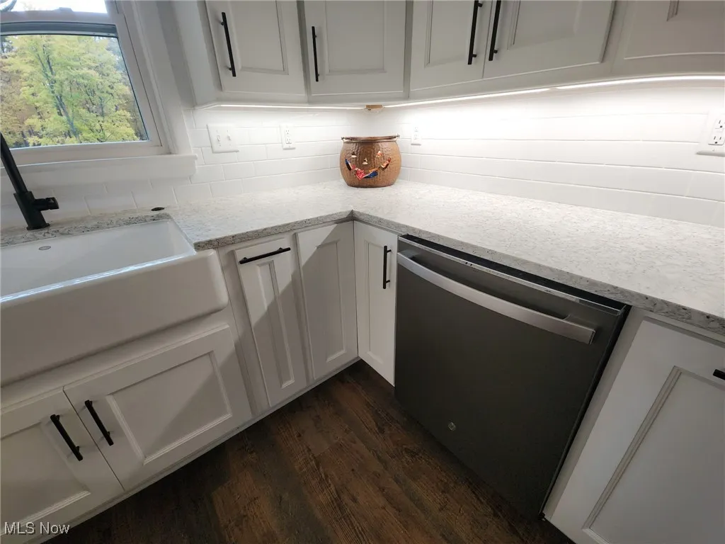 Beautiful soft close cabinets, subway tile backsplash, under counter lighting, all new stainless steel appliances stay.  Farmers sink with garbage disposal. Luxury vinyl flooring. Quartz counter