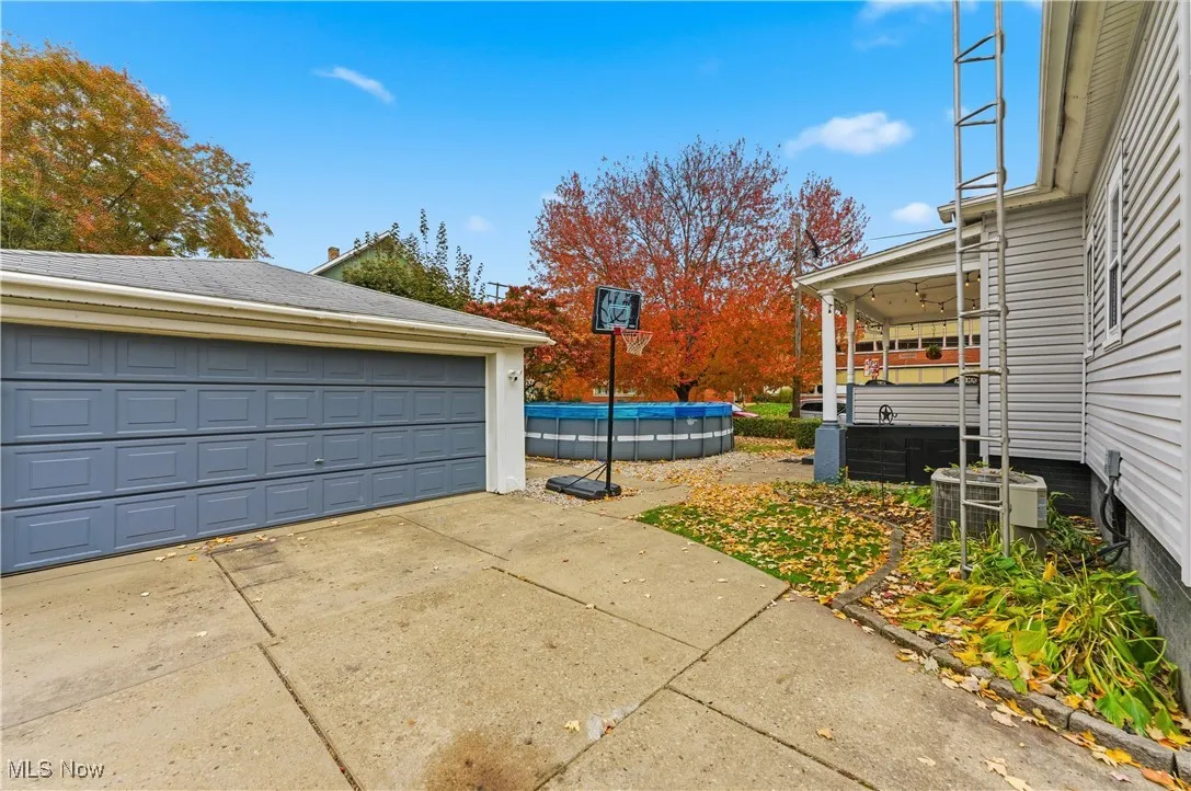 Detached garage with a 24' above-ground pool