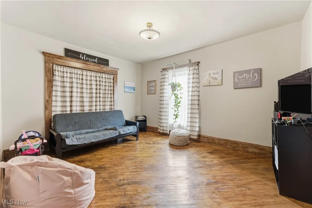 Main Floor Bedroom 1 / Den wood floors and baseboards