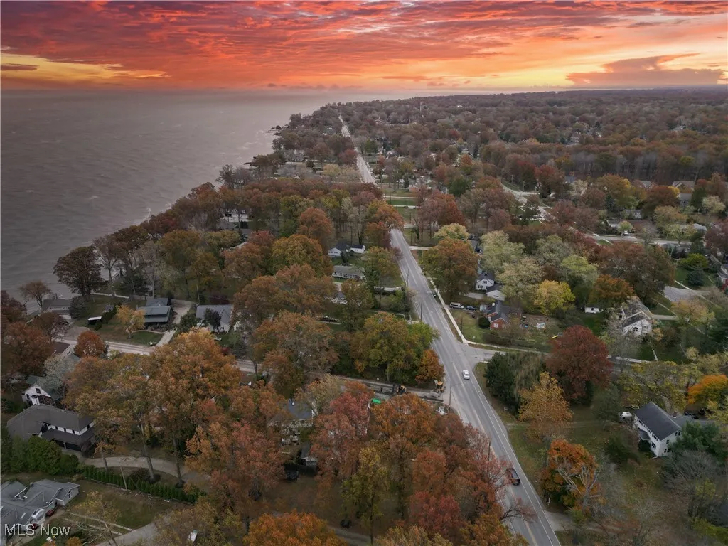 Aerial view of property's location with a large body of water