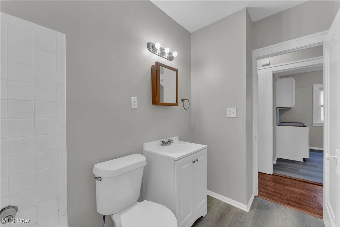 Bathroom featuring vanity and light wood-style floors