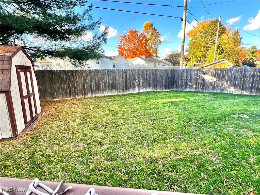 fenced yard with shed