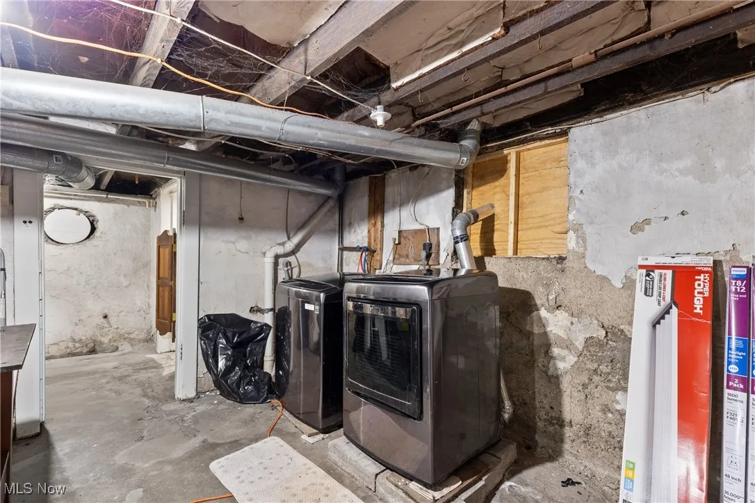Unfinished basement with separate washer and dryer