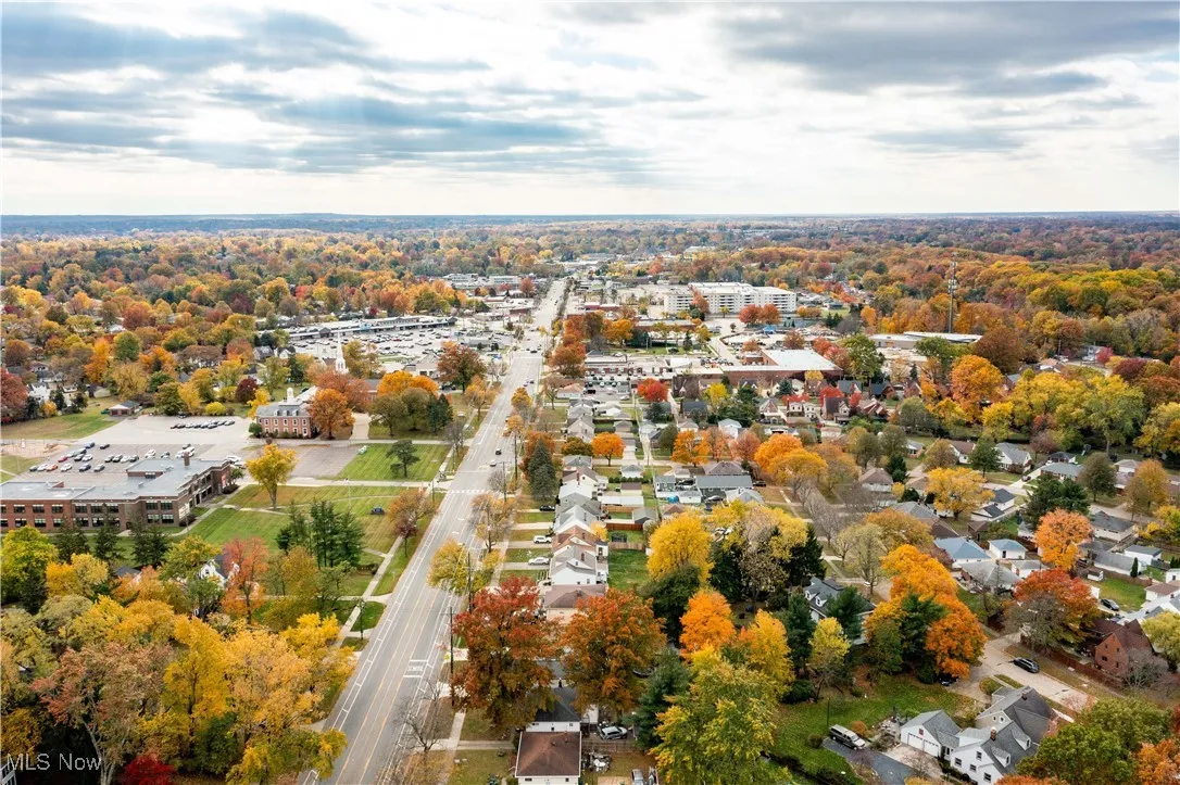 Aerial view of home showing more of surrounding neighborhood