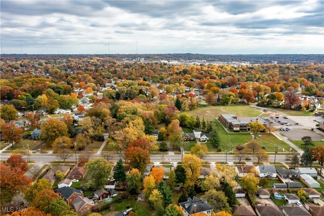 Aerial view of home showing more of surrounding neighborhood