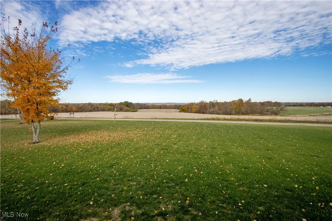 View of green lawn featuring a view of countryside