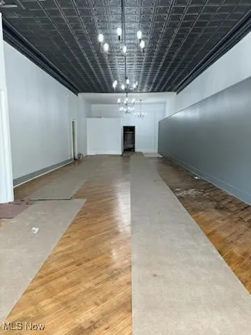 Unfurnished room featuring a paneled ceiling