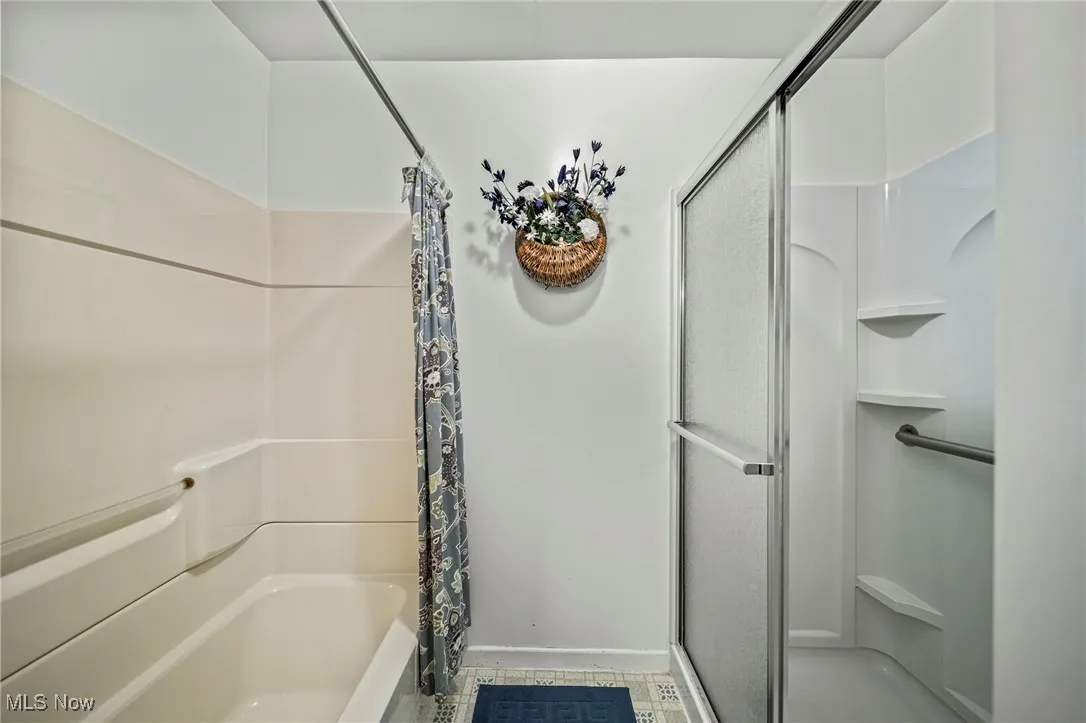Bathroom with walk in shower & tub shower