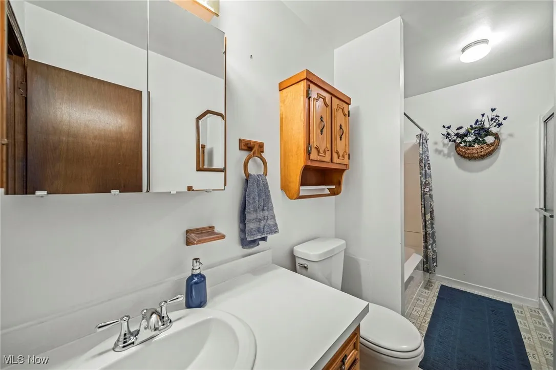 Full bath featuring tub shower and walk in shower