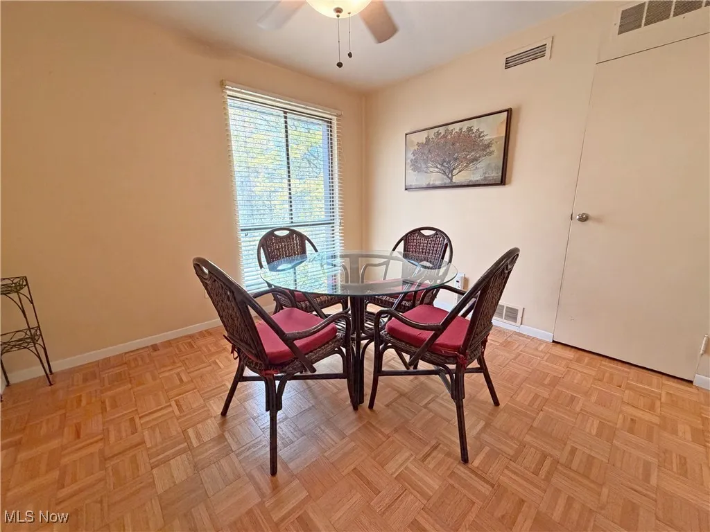 Dining space with baseboards and a ceiling fan