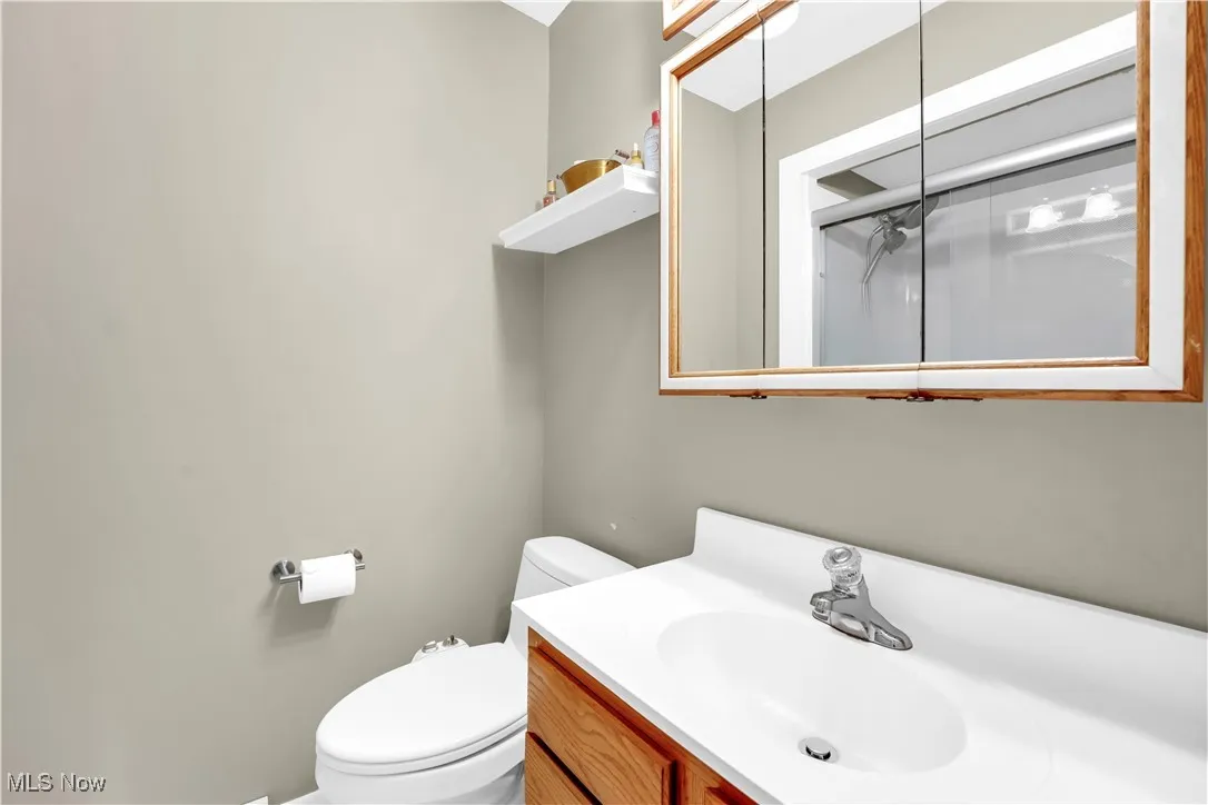 Bathroom with vanity and a shower