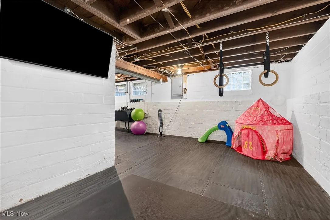 Rec room with healthy amount of natural light and electric panel