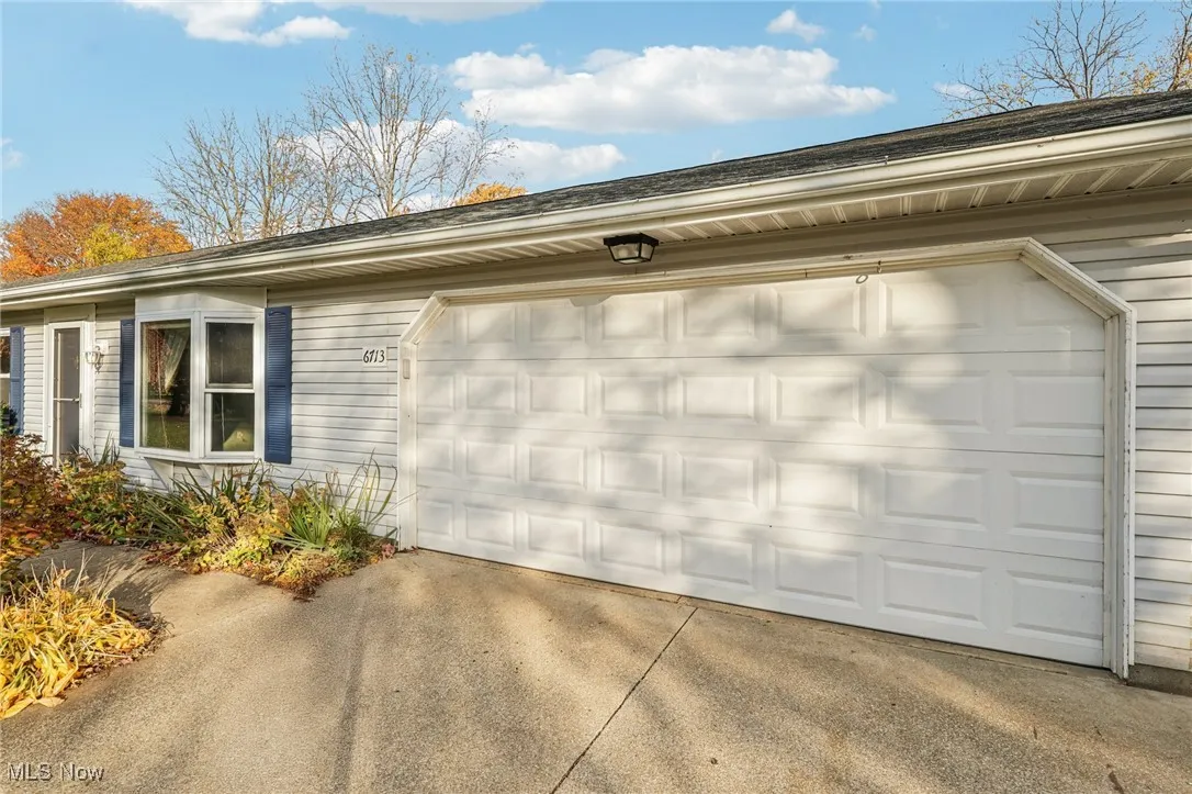 Garage with concrete driveway
