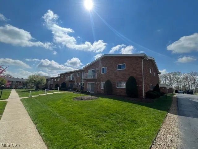 sidewalk, extra parking available in parking lot plus your own garage space