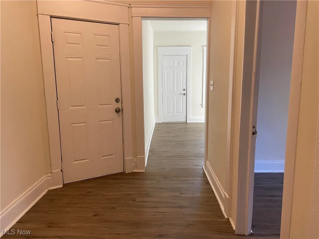 Hall featuring dark wood-style floors