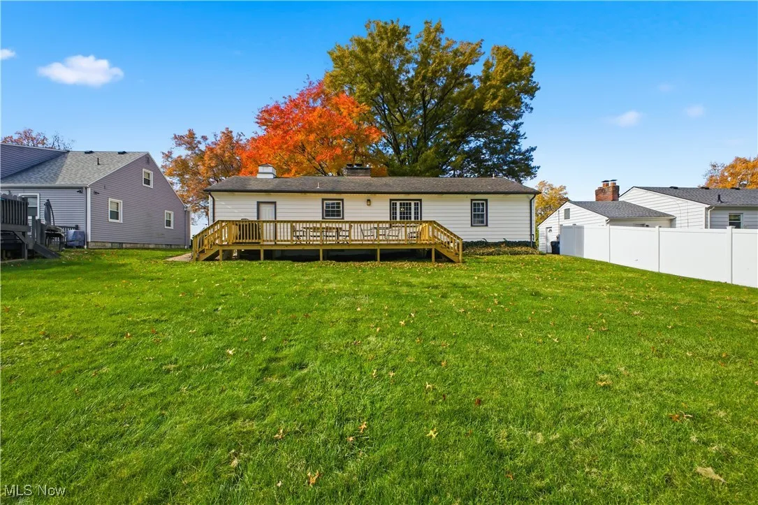 Back of house with a deck