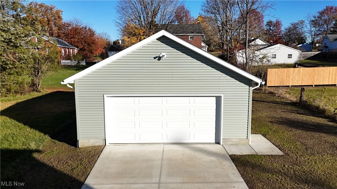 Detached garage featuring driveway
