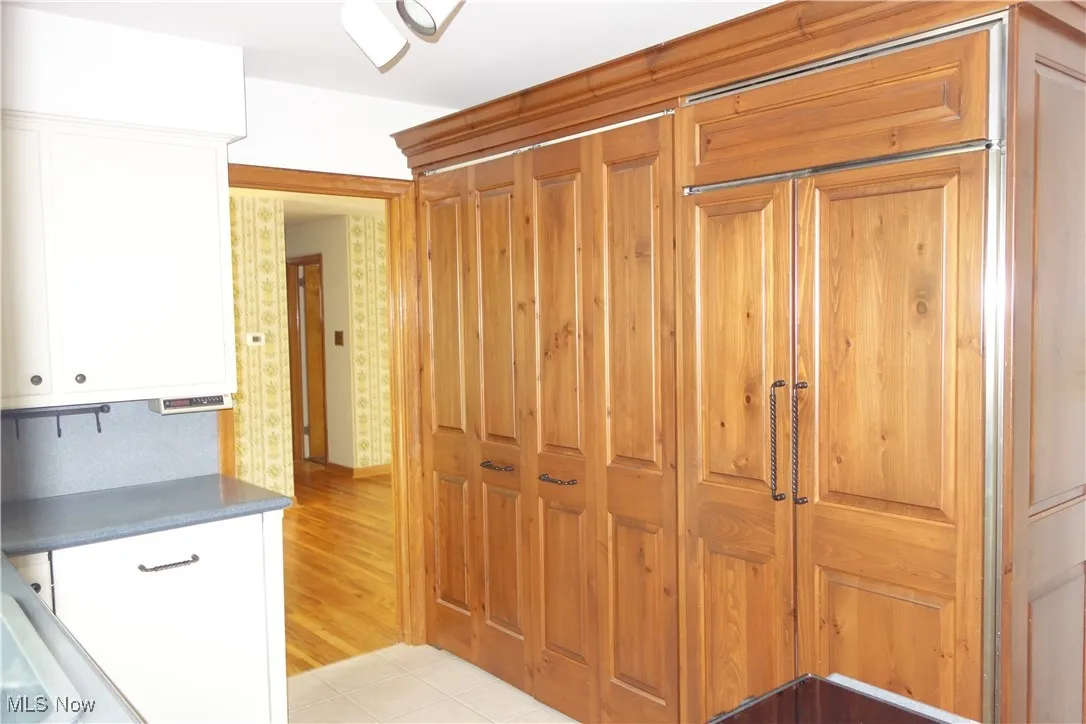 Kitchen w/Wood Detailed doors on the Mega-size Pantry &  Refrigerator