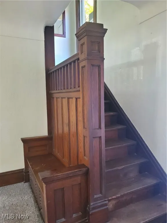 Stairs featuring baseboards