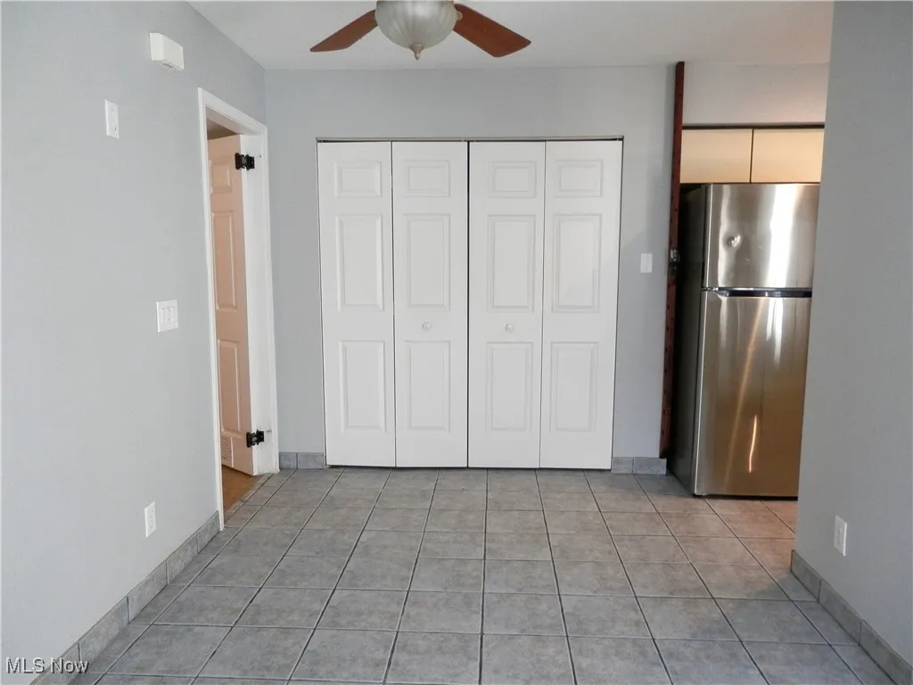 Unfurnished bedroom with freestanding 



















Dining area with ceramic tile floor and ceiling fan