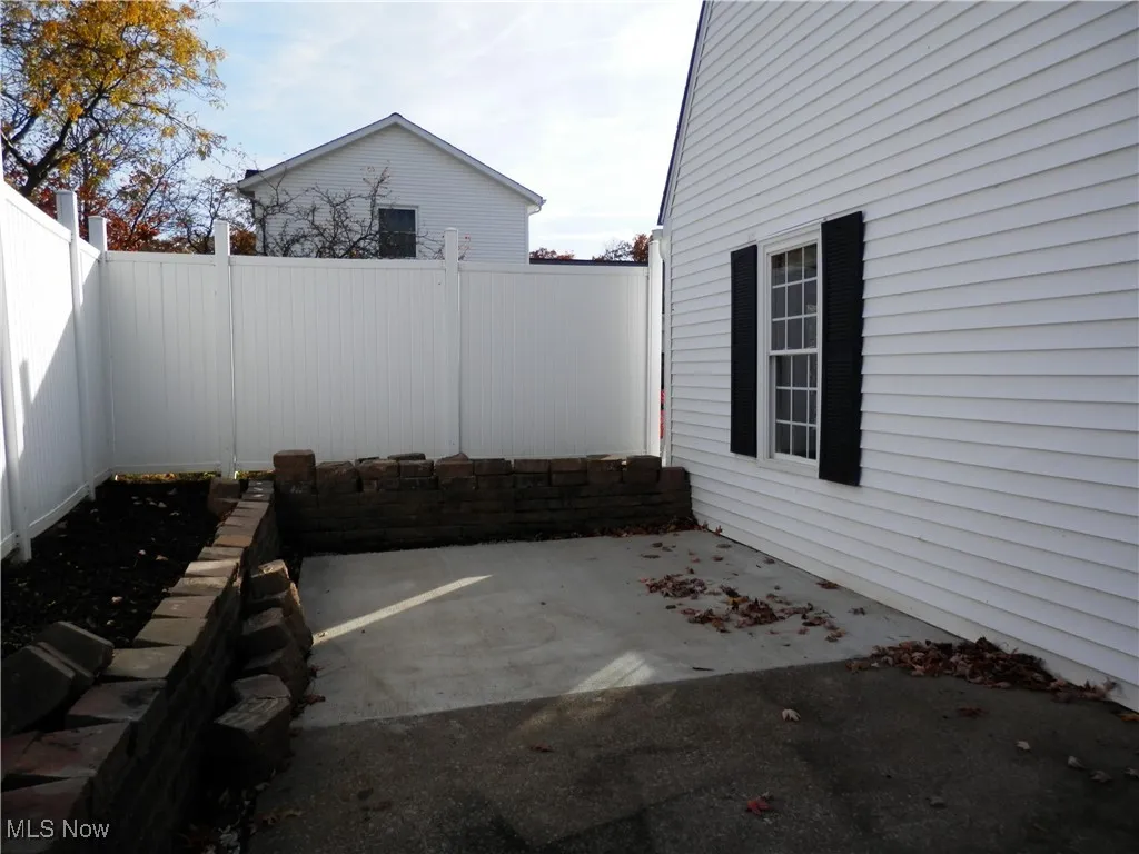 Spacious patio with privacy fence

