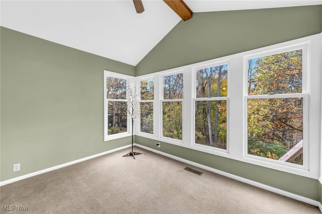 4-Season Sun Room has vaulted ceiling and large windows to offer a panoramic view of nature's beauty.