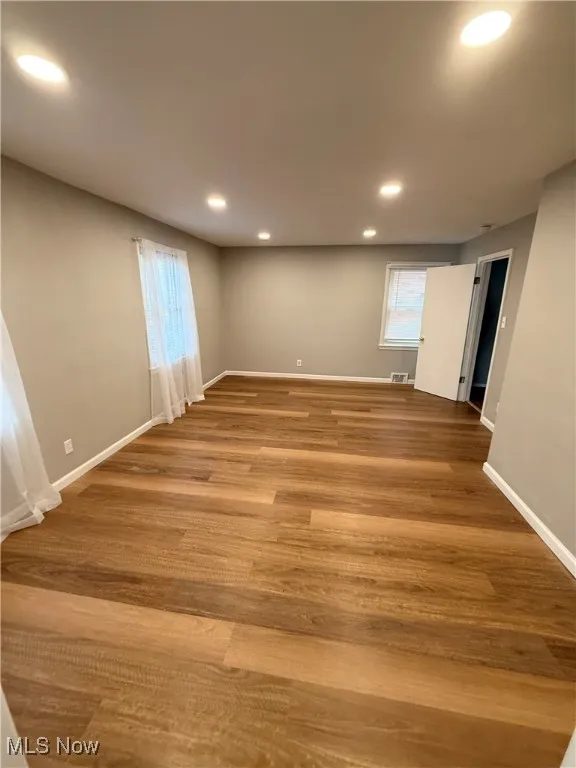 Basement with recessed lighting and light wood finished floors