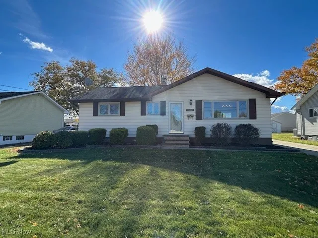 View of front of home featuring a front yard and entry steps