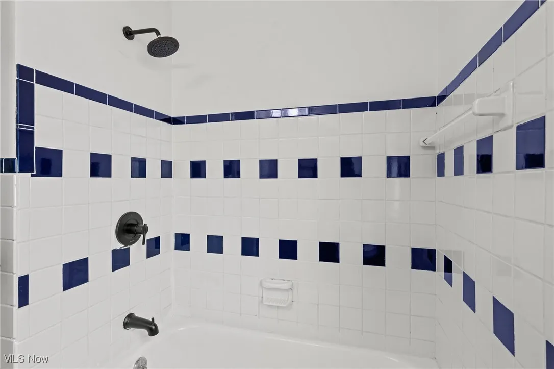 Full bathroom featuring tub / shower combination