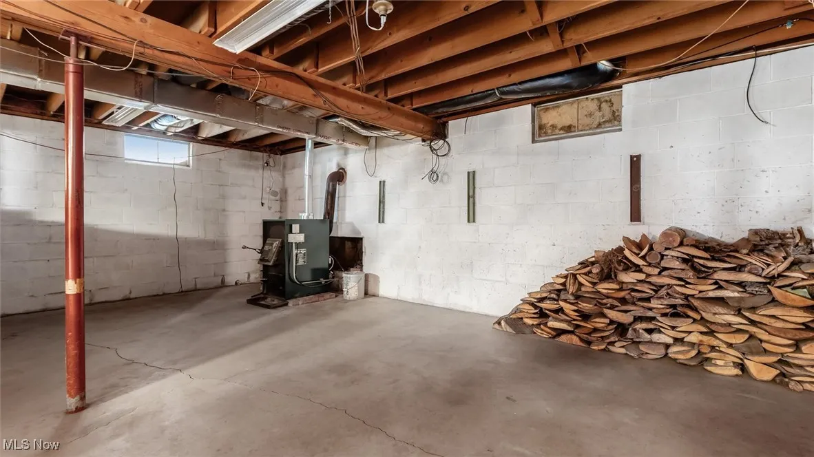 Basement featuring a heating unit