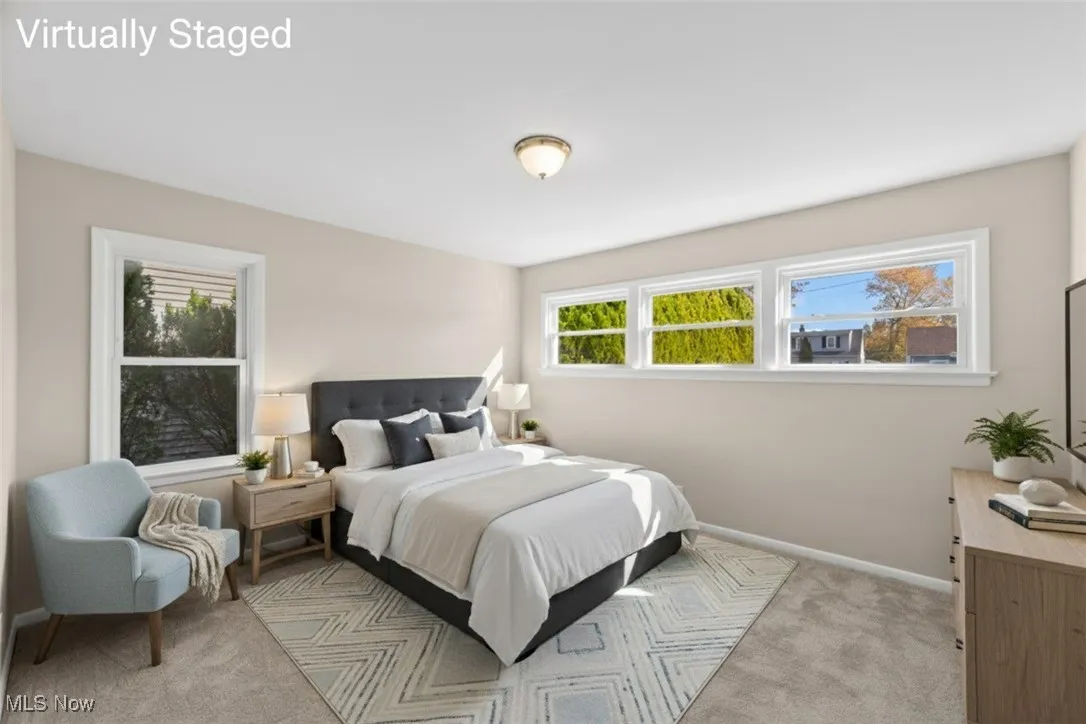 Bedroom with carpet and baseboards
