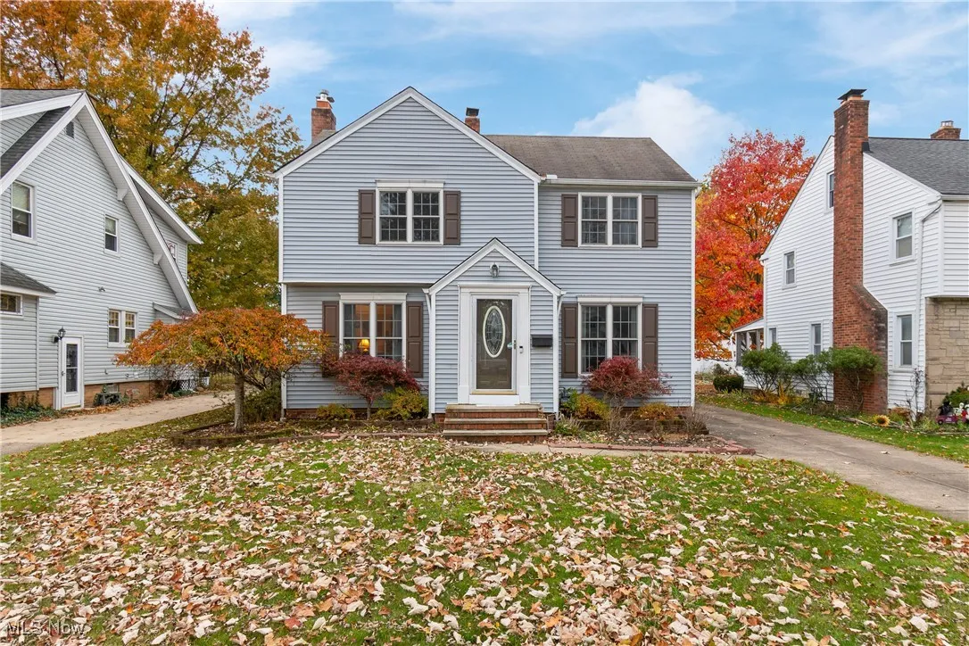 View of front of home featuring a chimney