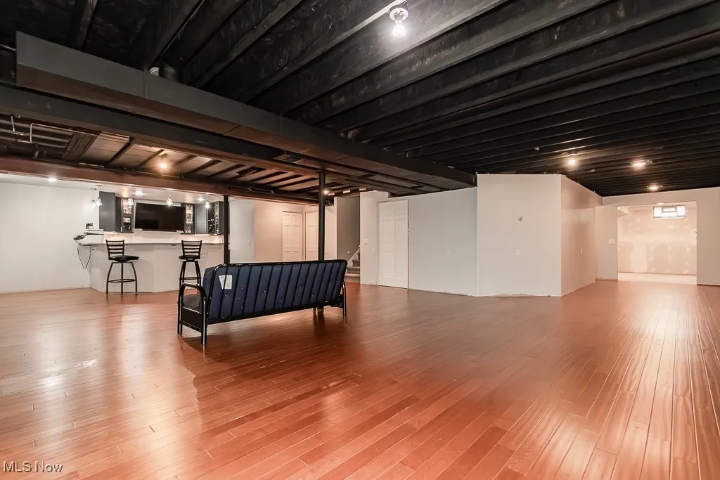 Finished basement featuring light wood finished floors