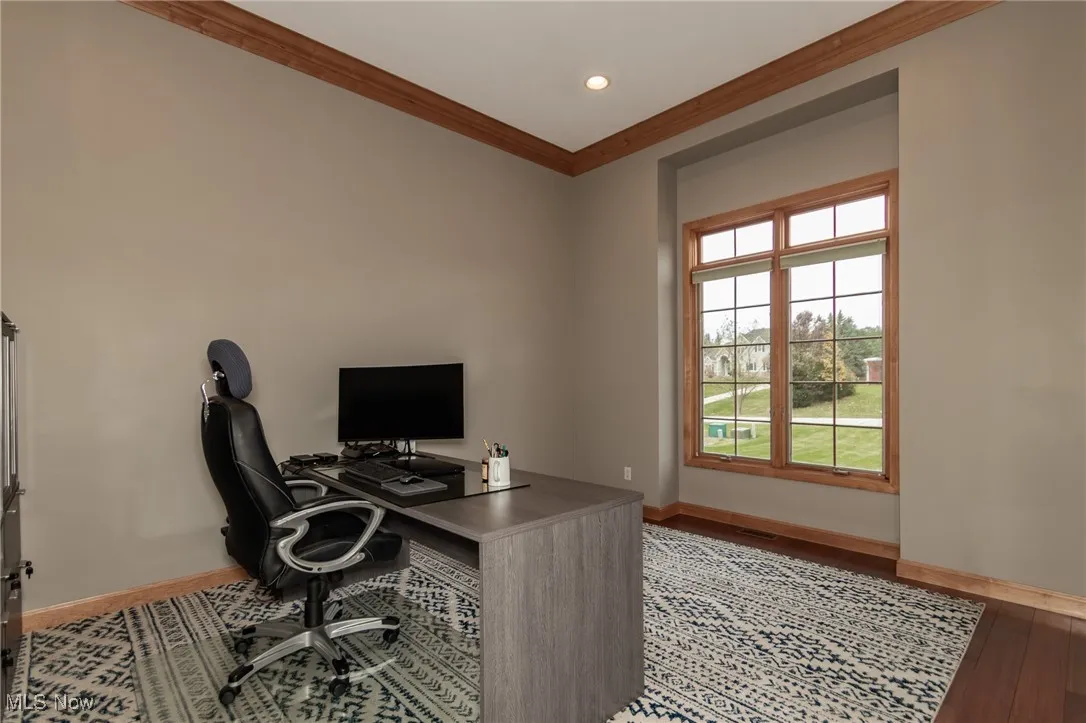 Office with ornamental molding, wood finished floors, and recessed lighting