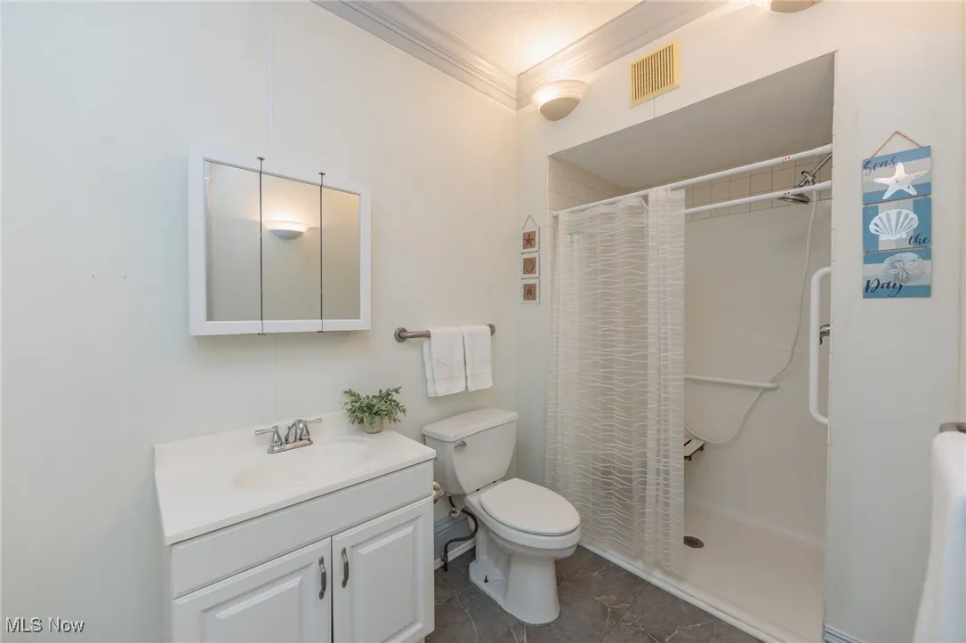 Bathroom featuring crown molding