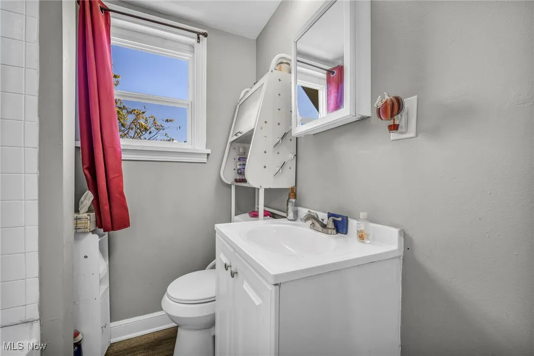 Full bathroom with vanity and toilet