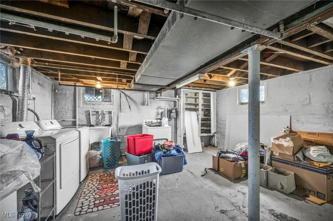 Below grade area with independent washer and dryer and healthy amount of natural light