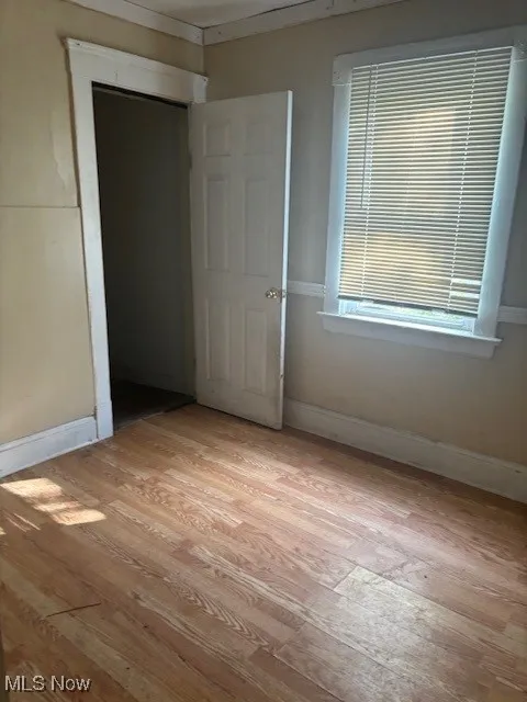 Bedroom with light wood floor