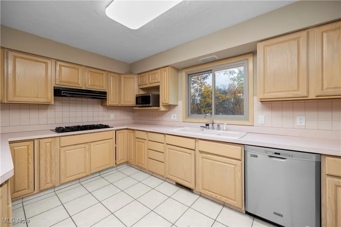 Kitchen with light brown cabinetry