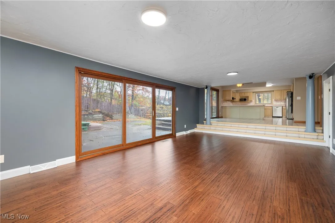 Living room with wood finished floors and baseboards
