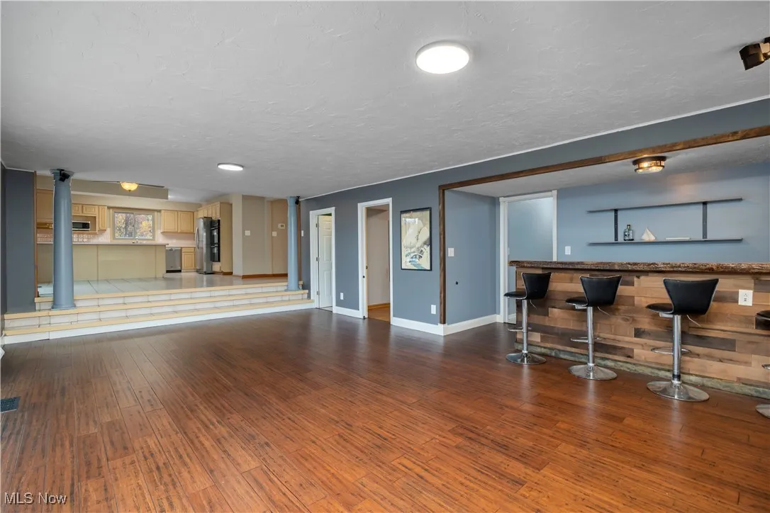 Living room and view into kitchen