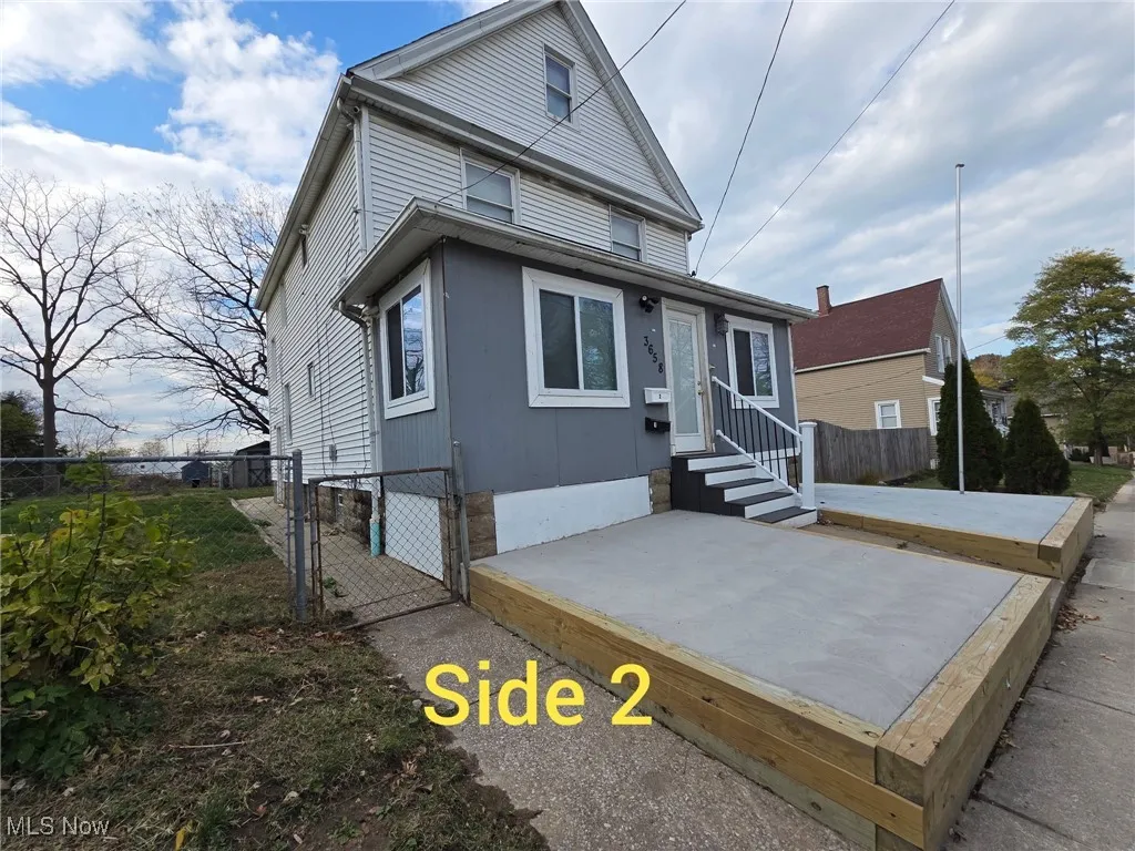 View of front of house with a gate