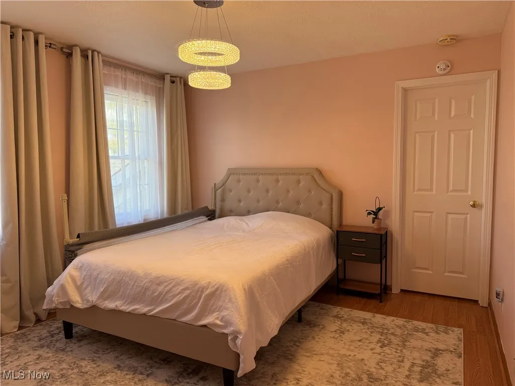 Bedroom with wood finished floors