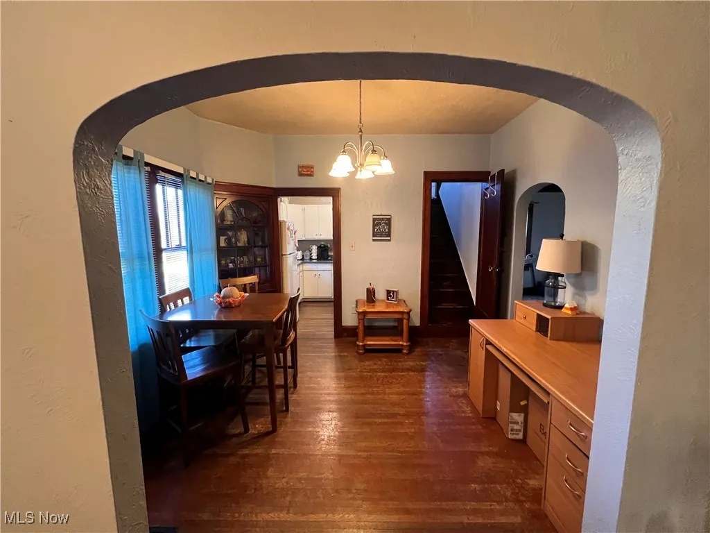 Dining Room with built in and arched doorway