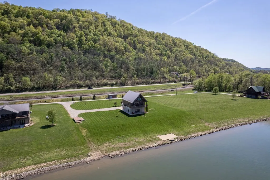 Additional aerial.  Property extends to the main highway. Owner has a survey for new owner.