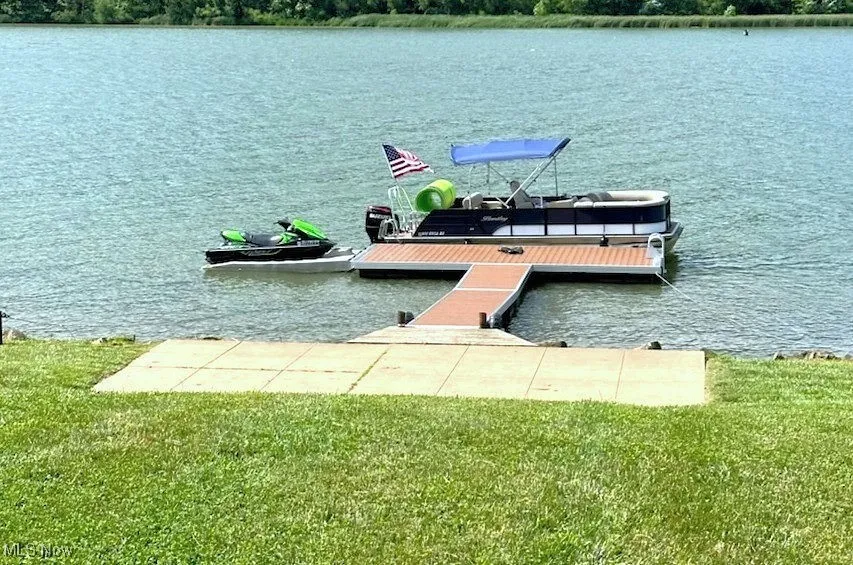 Dock area nice concrete pad -view when dock in place for the Summer Jet Ski ramp is not included.