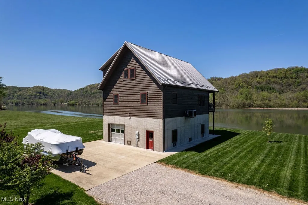 Additional view of concrete parking pad and beautiful river views.