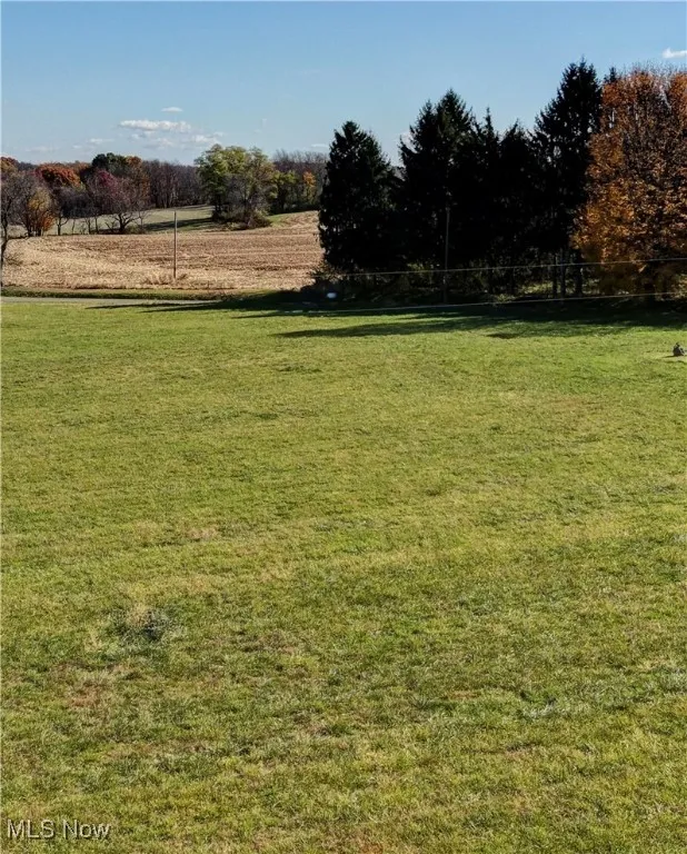View of green lawn with a view of rural / pastoral area